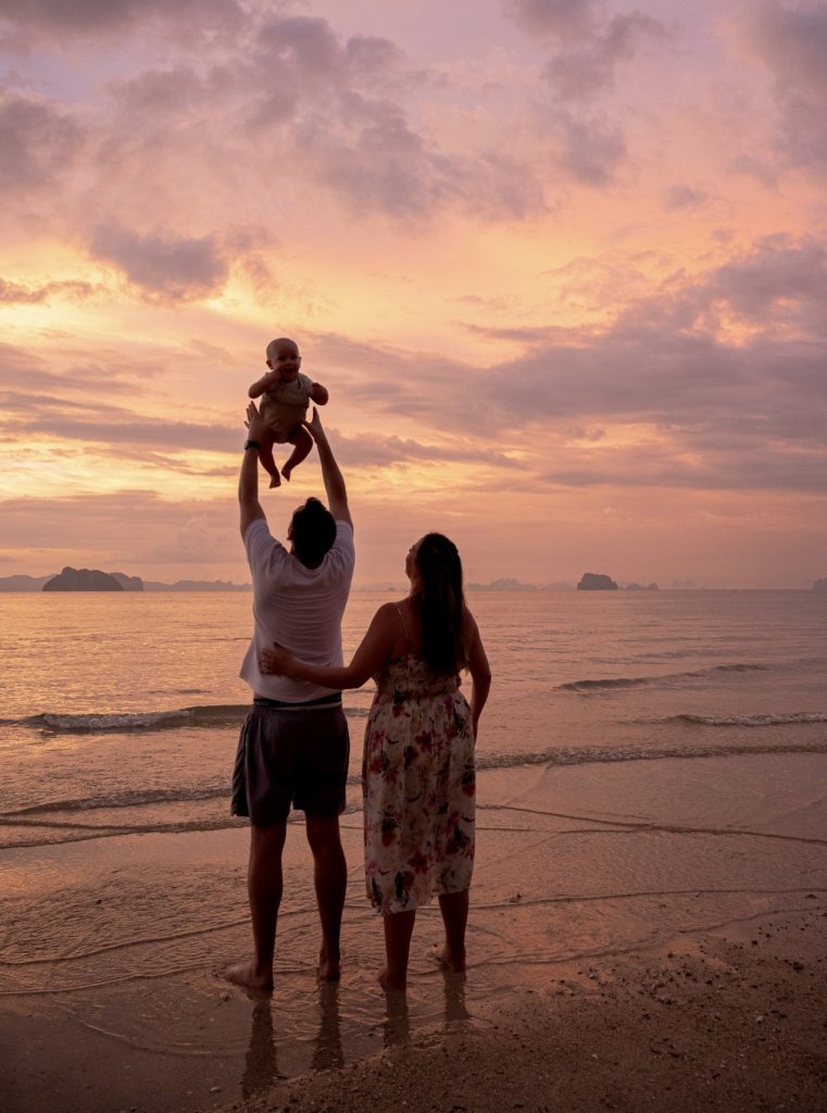 Family beach photography in Krabi with natural smiles, candid moments, and beautiful sunset scenery.